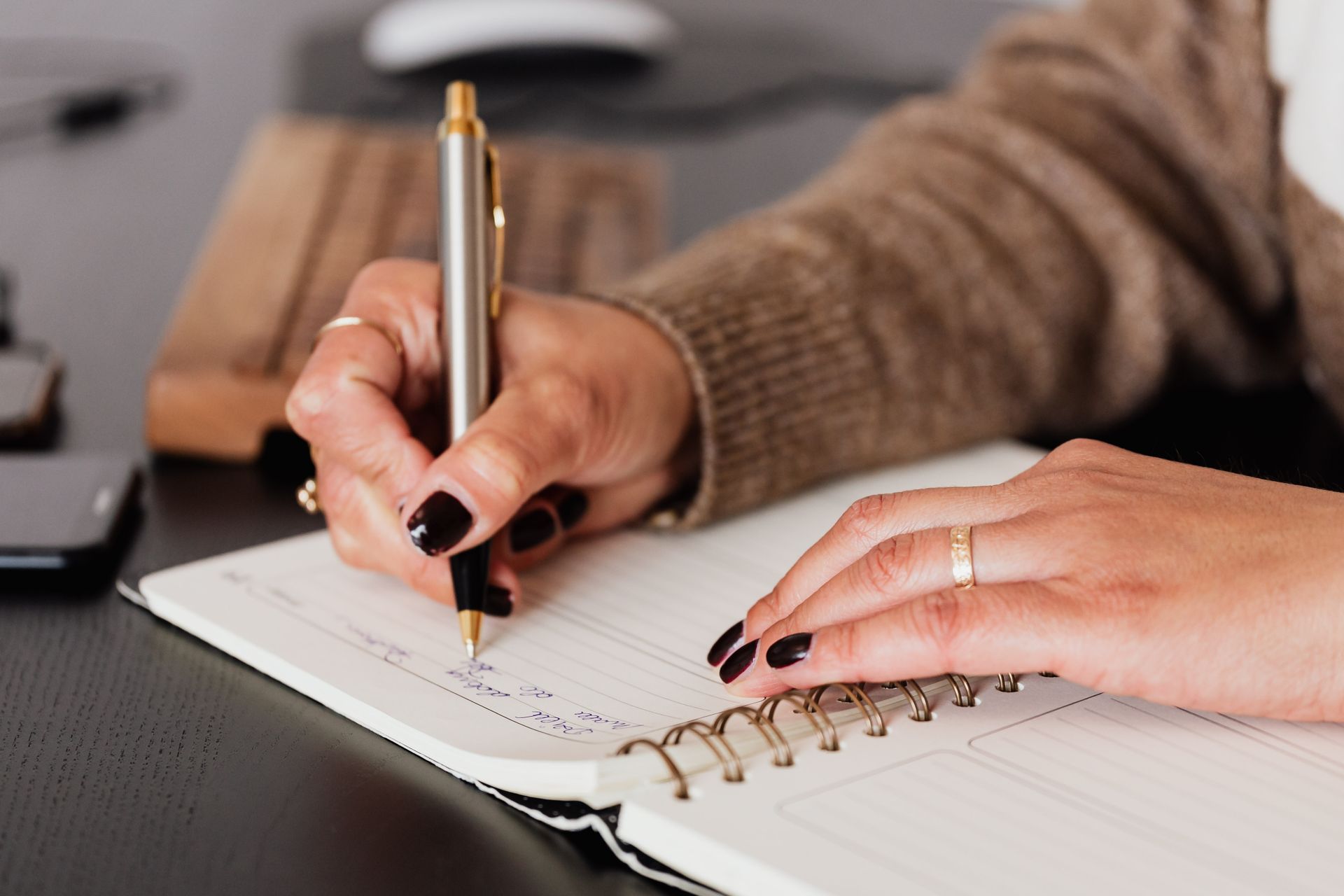 Handwritten notes held gently before speaking