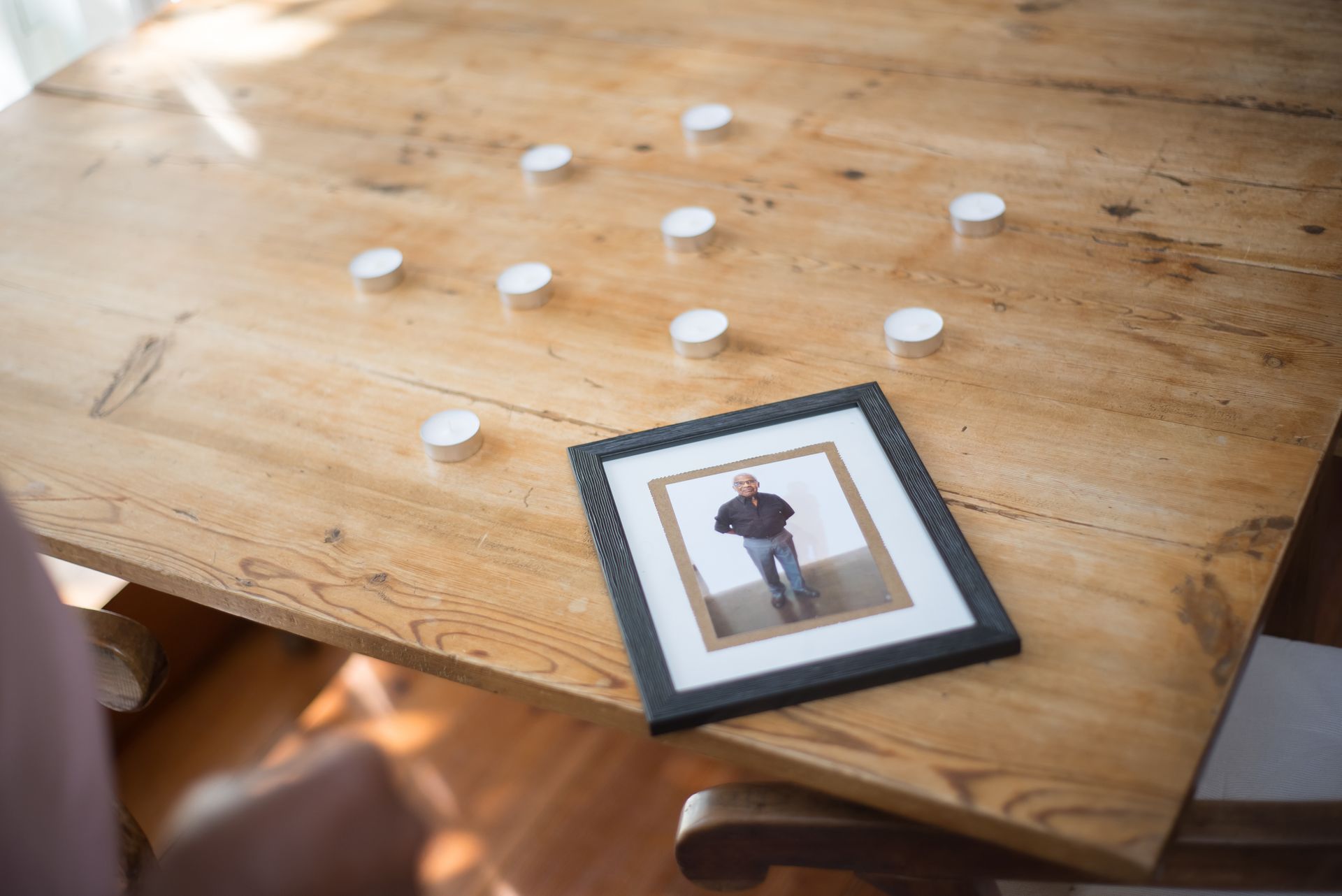 Old photographs spread across a table
